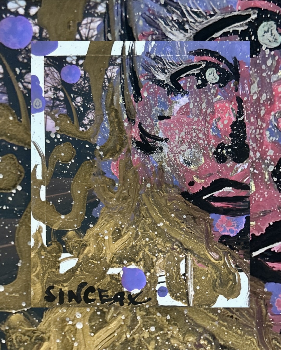 a speckled pink and purple face with heavy black features over bare tree branches, framed in gold-ochre swirls