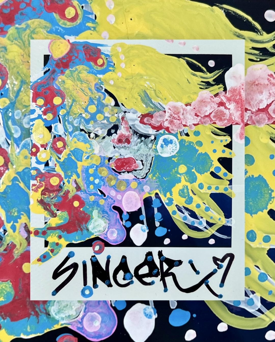 splatters and drips of yellow, cyan, crimson, and pink forming an abstracted face on a dark ground